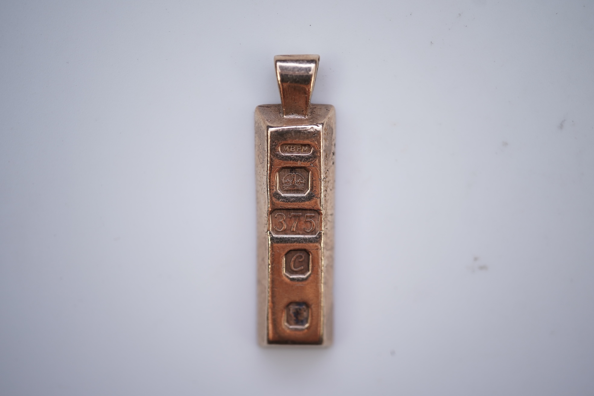 Two gold pendants